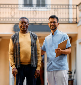 young man and elderly man smiling