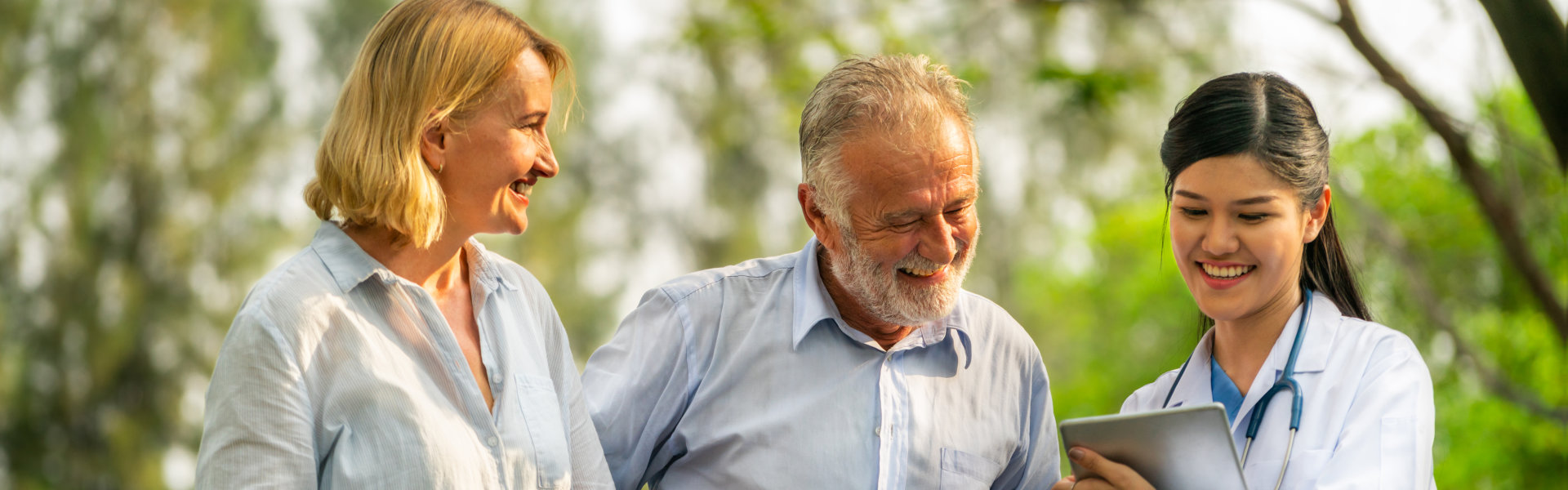 senior couple with their caregiver