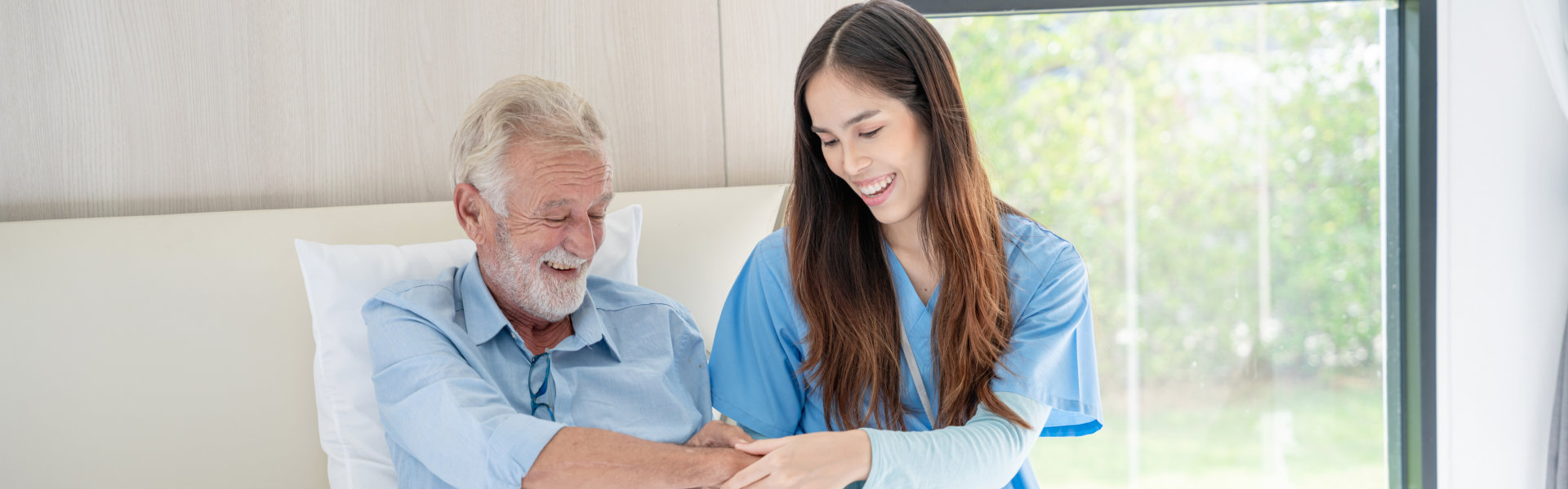 caregiver taking care of elderly man