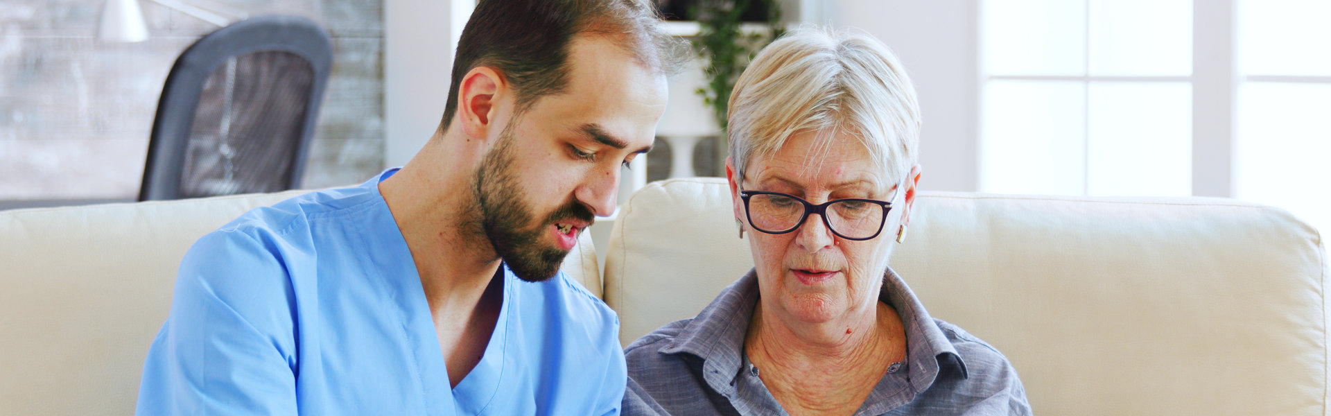 caregiver teaching elderly woman