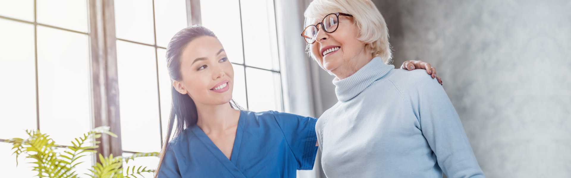 caregiver assessing the elderly woman