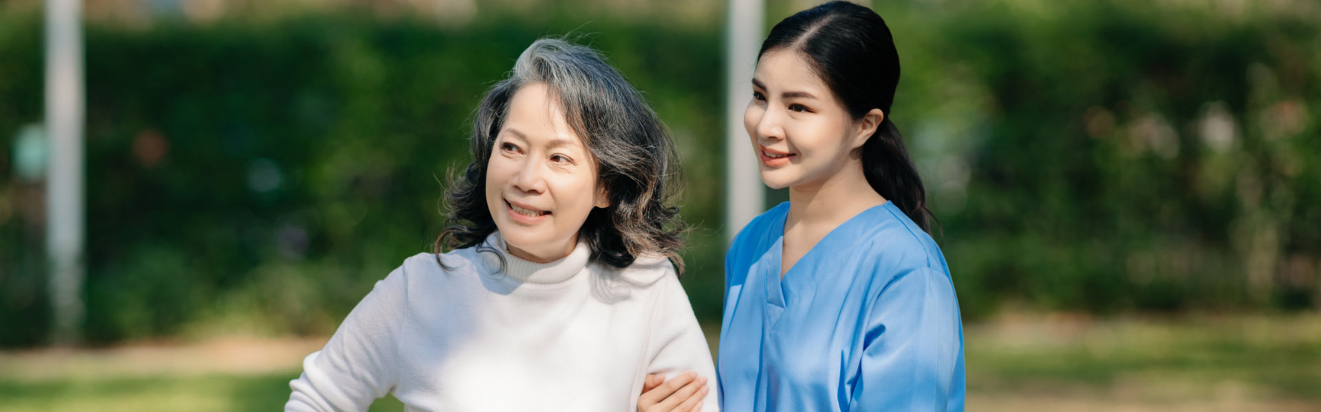 caregiver assessing the elderly woman