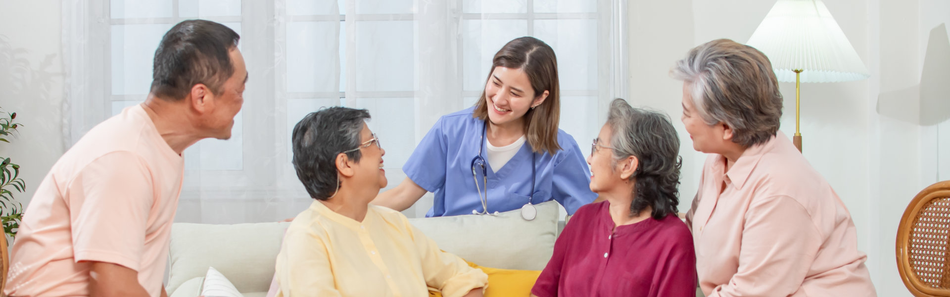 caregiver and elderls smiling