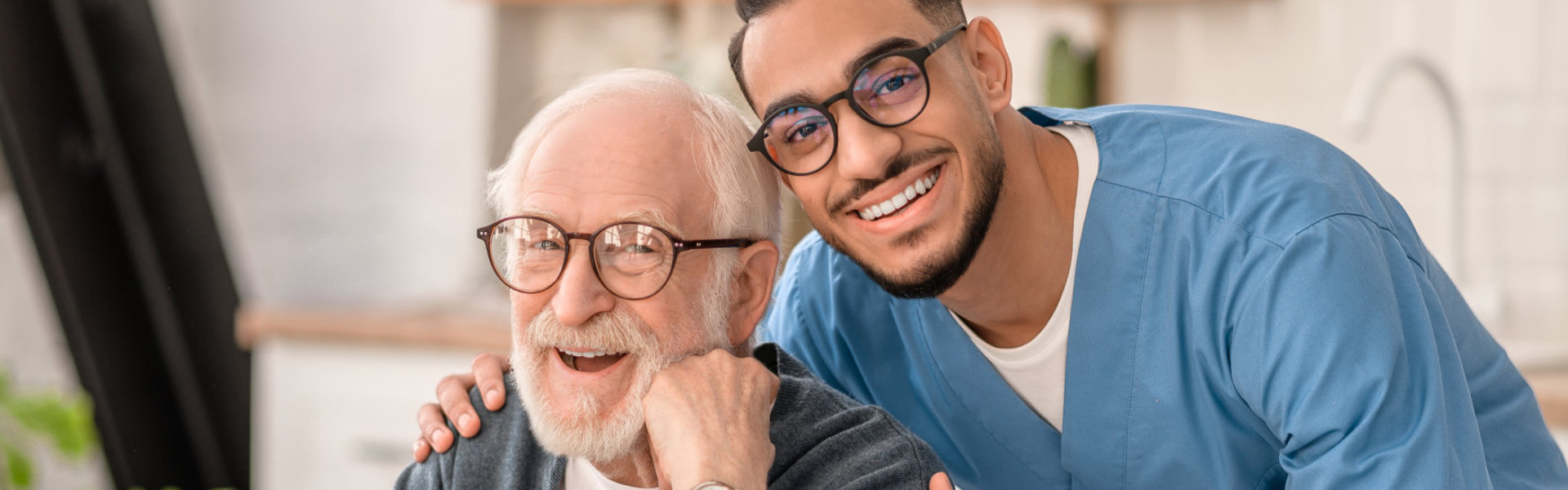 elderly man and young man smiling